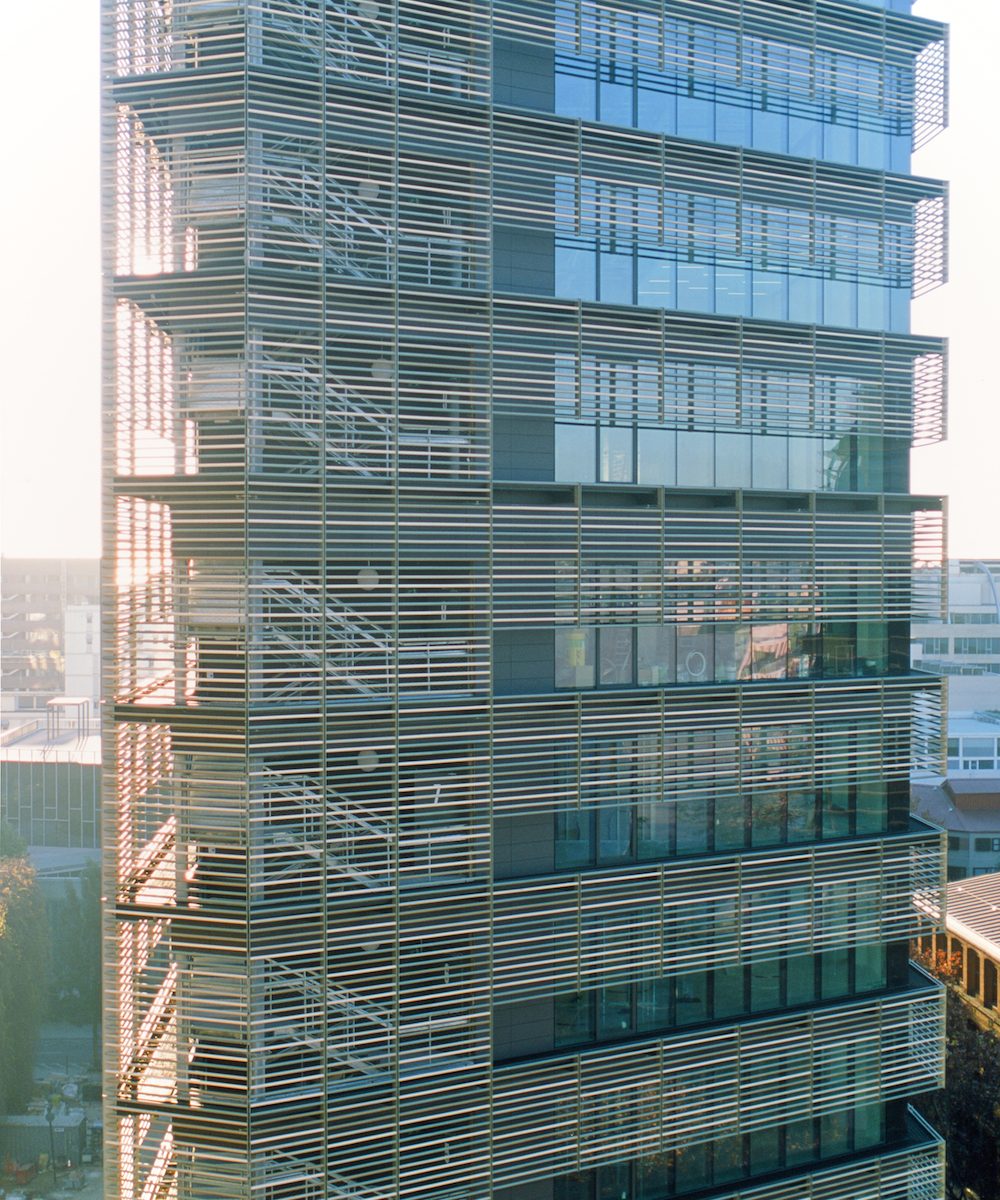 A high-rise building with a striped exterior