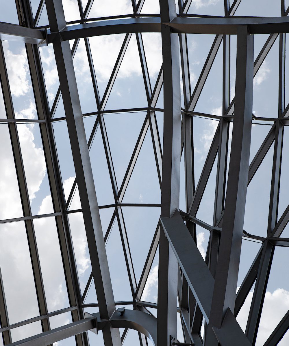 Metal beams and blue sky in background