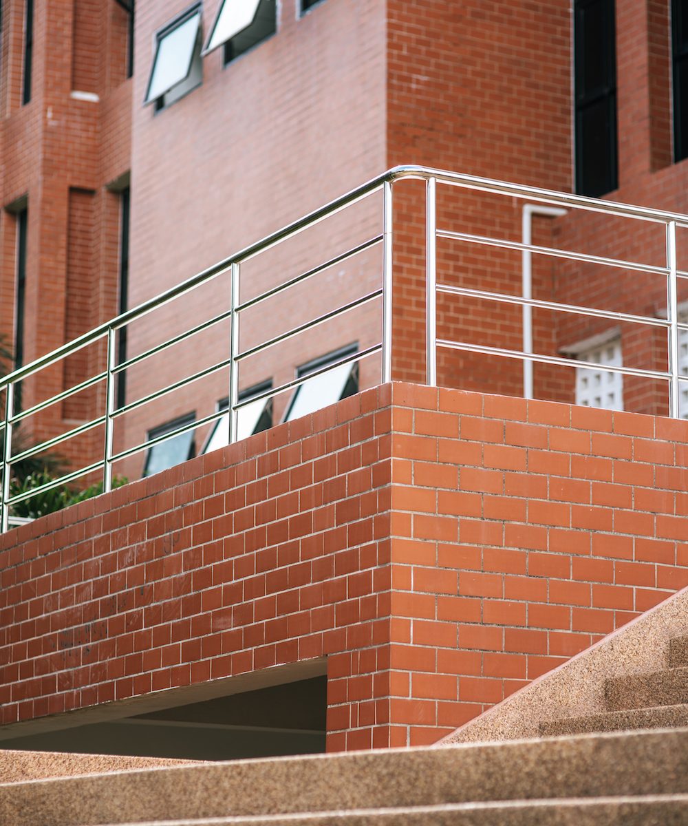 The university building is made of orange bricks.